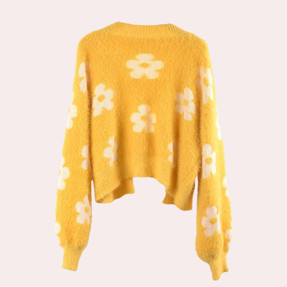 Gele trui met witte bloemenprint, lange mouwen en losse pasvorm. Trendy dameskleding, perfect voor casual en modieuze outfits.