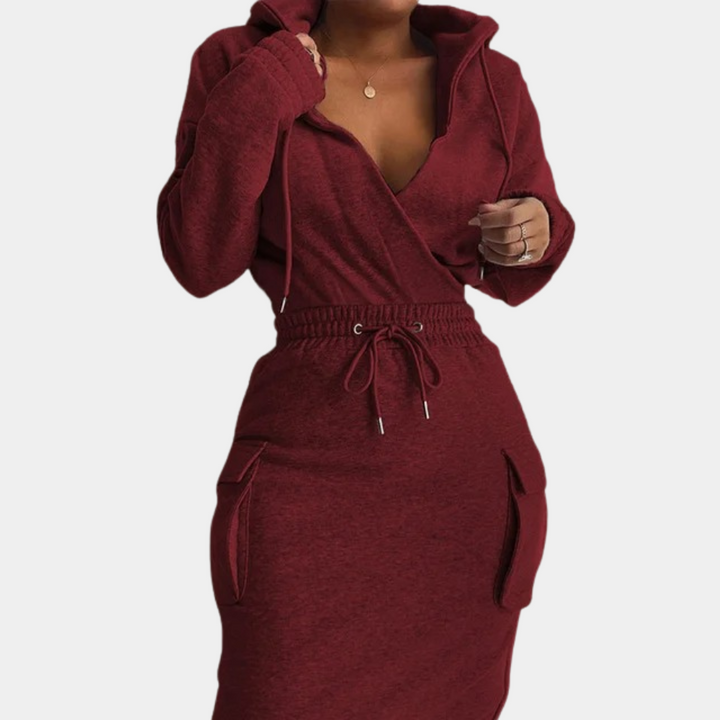 Rode damesjurk met capuchon, lange mouwen en zakken. Comfortabele pasvorm, ideaal voor casual en modieuze looks. Perfect voor herfstmode.