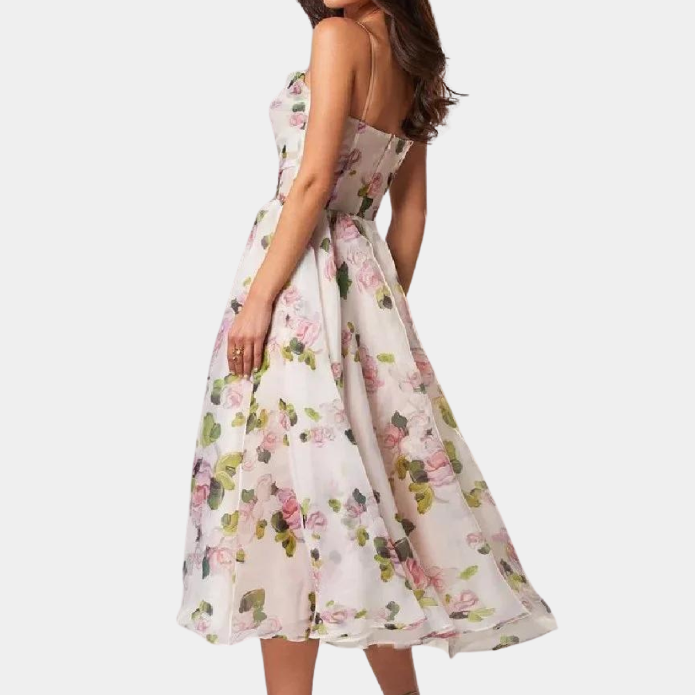 Witte bloemenjurk met strapless ontwerp, elegante A-lijn snit en kleurrijke bloemenprint. Perfect voor zomerse evenementen en bruiloften.