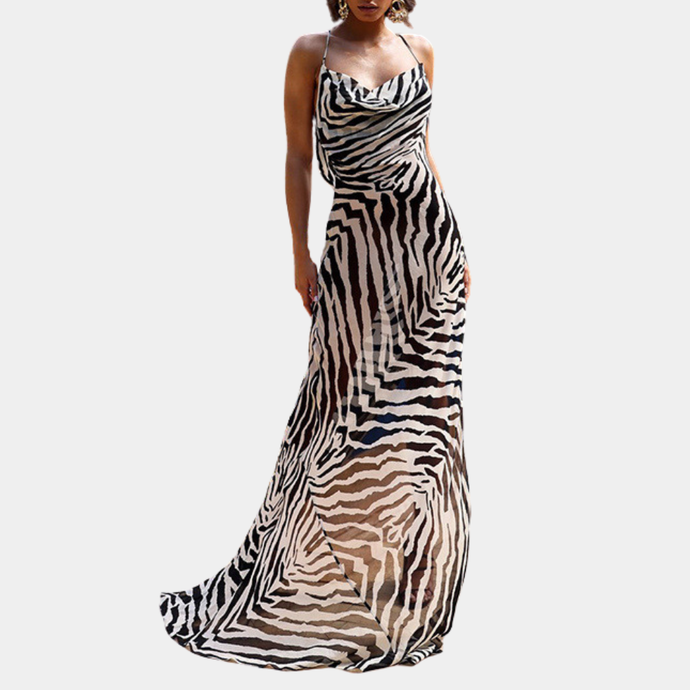 Zwart-witte zebraprint jurk, lange avondjurk met spaghettibandjes, elegante damesmode, trendy design, perfecte outfit voor speciale gelegenheden.