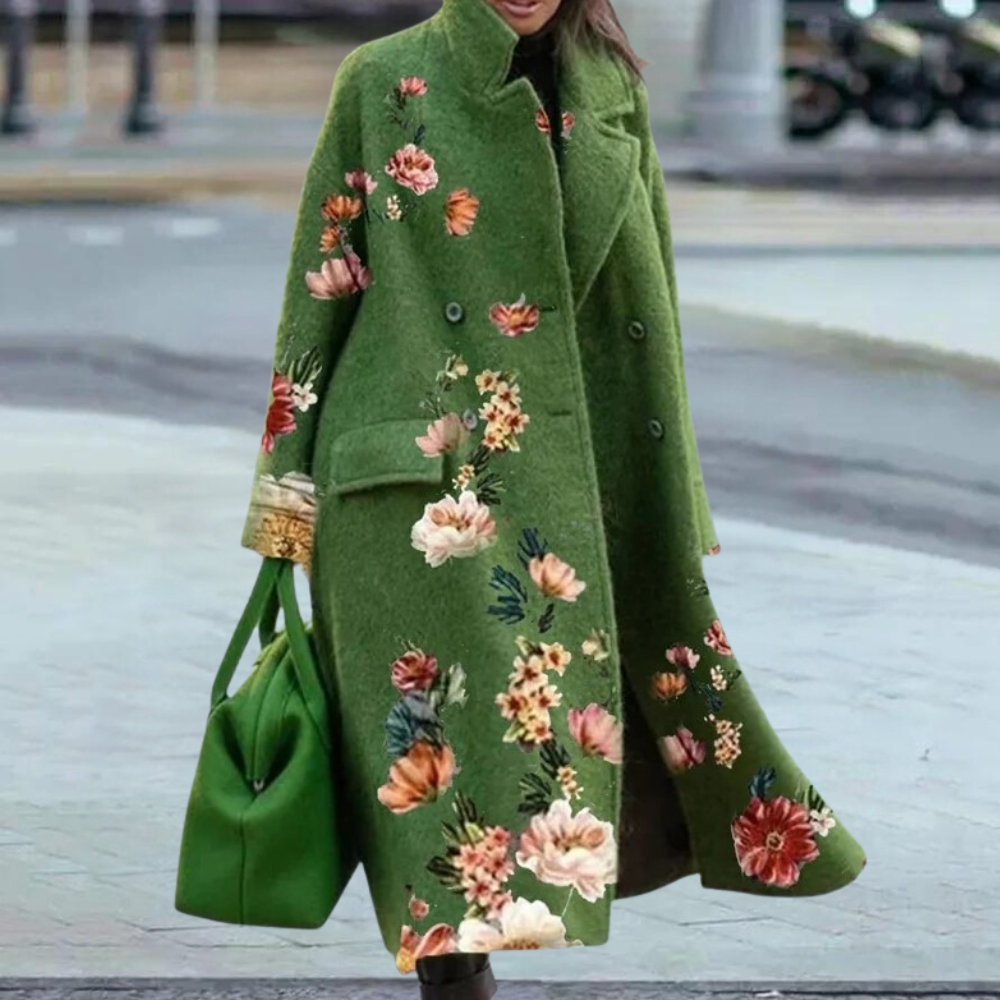 Groene wollen damesjas met kleurrijke bloemenprint, dubbele knopenrij en bijpassende groene handtas. Stijlvolle wintermode voor vrouwen.