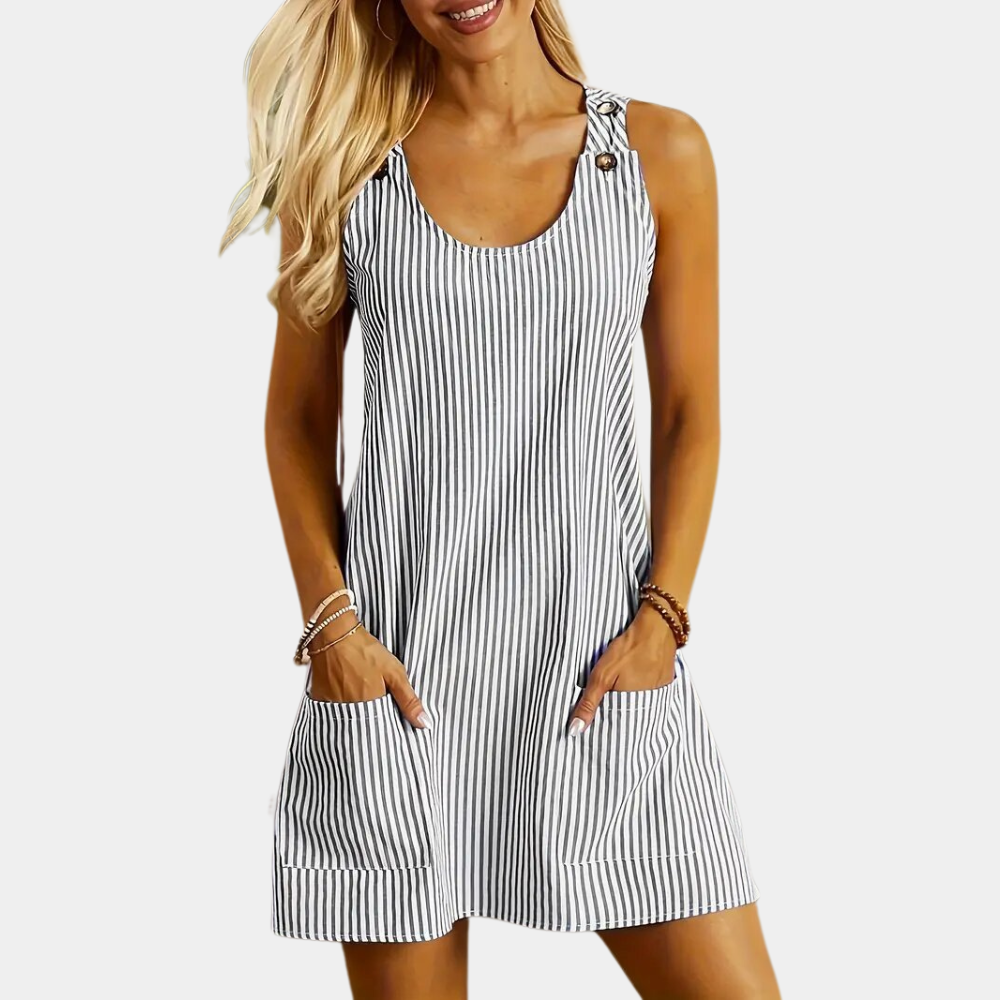 Gestreepte zomerse damesjurk met knoopdetails, mouwloos ontwerp en zakken, ideaal voor casual en strandoutfits. Comfortabele en stijlvolle pasvorm.