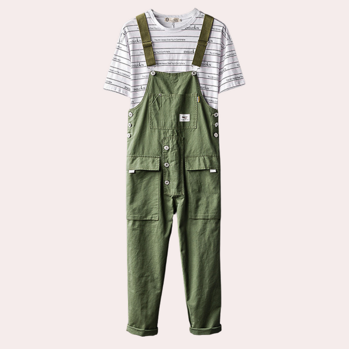 Groene kinderoverall met witte gestreepte T-shirt, duurzame katoenen stof, verstelbare schouderbanden, modieuze kinderkleding, uniseks ontwerp.