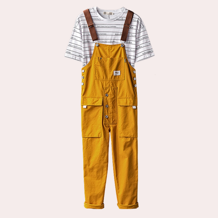 Gele kinderoverall met bruine bretels en witte gestreepte T-shirt. Trendy kinderkleding, comfortabele pasvorm, duurzame materialen.