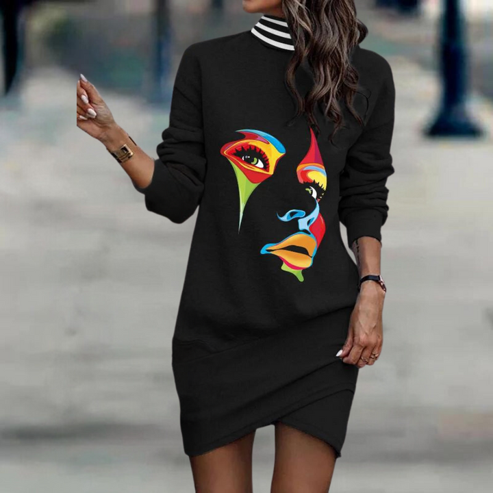 Zwarte sweaterjurk met kleurrijke abstracte gezichtsprint, lange mouwen en gestreepte kraag. Modieuze dameskleding, streetwear stijl.