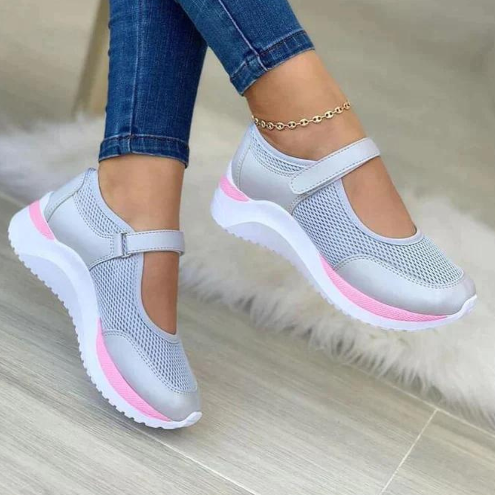 Dames sneakers met klittenband, grijs met roze accenten, ademend mesh, comfortabele dikke zool, ideaal voor casual en sportieve outfits.