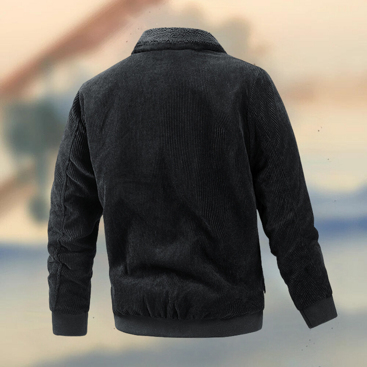 Zwarte corduroy jas voor heren, met geribbelde kraag en manchetten. Stijlvolle winterjas, perfect voor casual en formele gelegenheden.