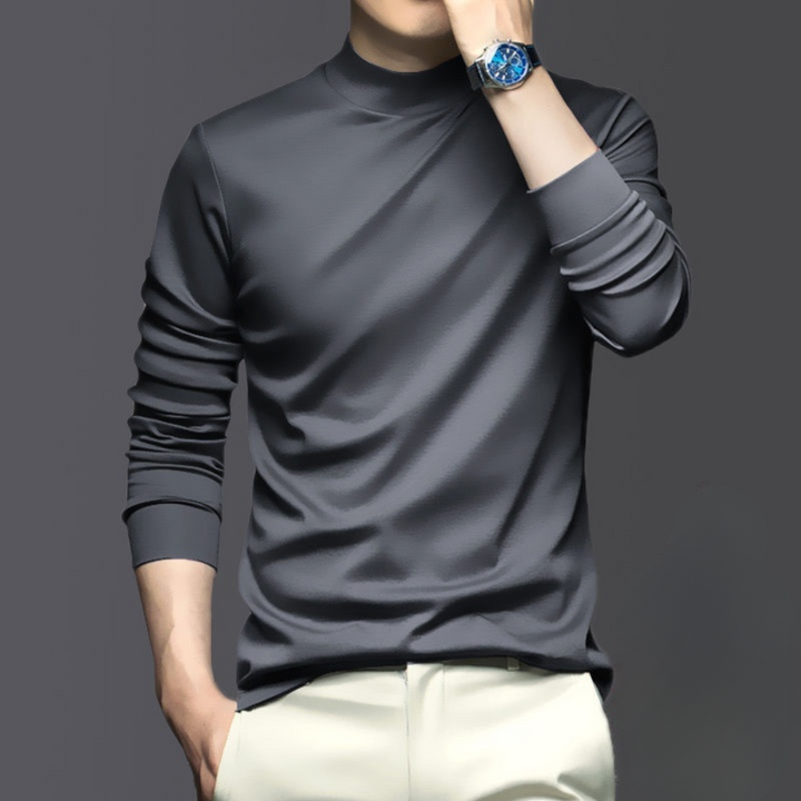 Grijze herentrui met lange mouwen, gedragen door een man met een blauw horloge. Stijlvolle casual outfit, ideaal voor herfstmode.