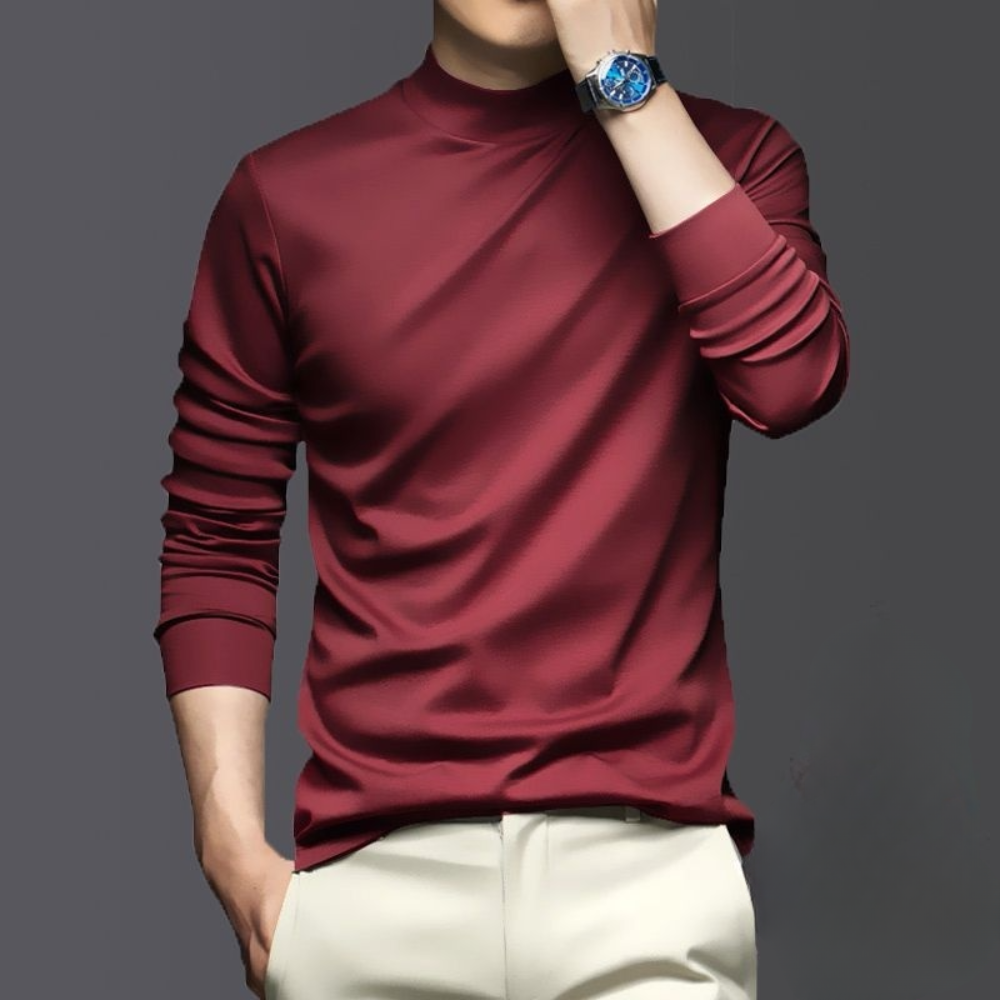 Man in bordeauxrood shirt met lange mouwen, draagt een blauw horloge. Stijlvolle herenkleding, casual mode, moderne outfit.