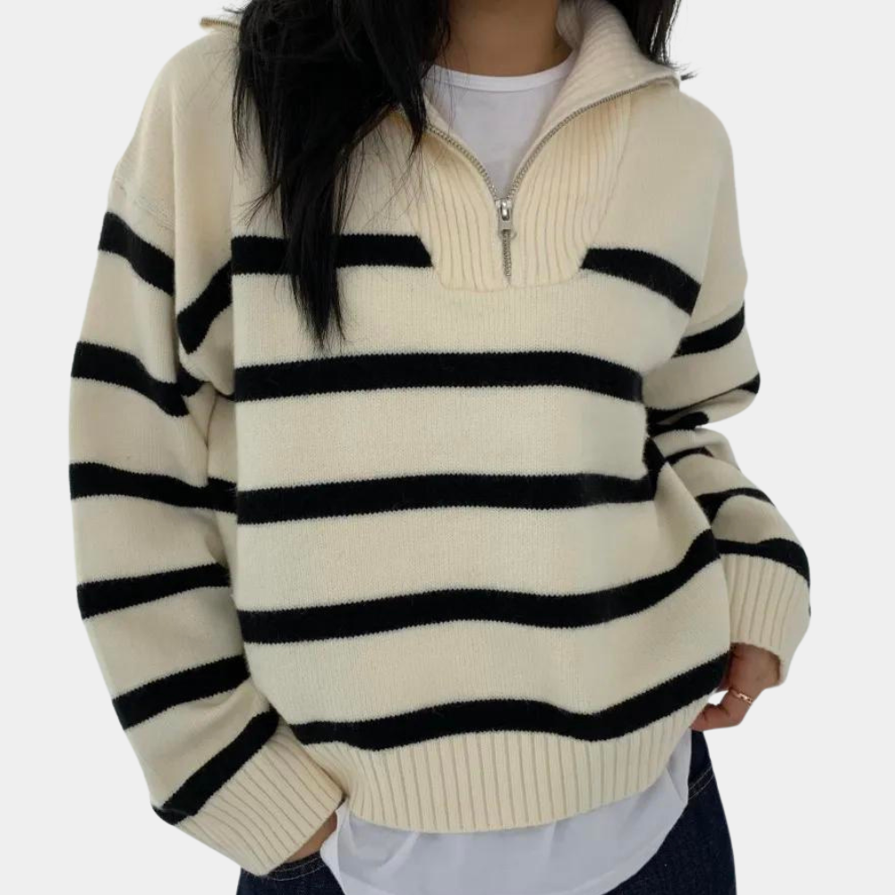 Damestrui met zwart-witte strepen, halve rits en opstaande kraag. Modieuze gebreide sweater, ideaal voor casual herfst- en winteroutfits.