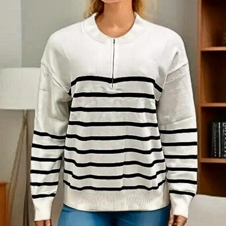 Witte damestrui met zwarte strepen, lange mouwen en halve rits, ideaal voor casual en modieuze outfits. Perfect voor herfst- en winterseizoenen.