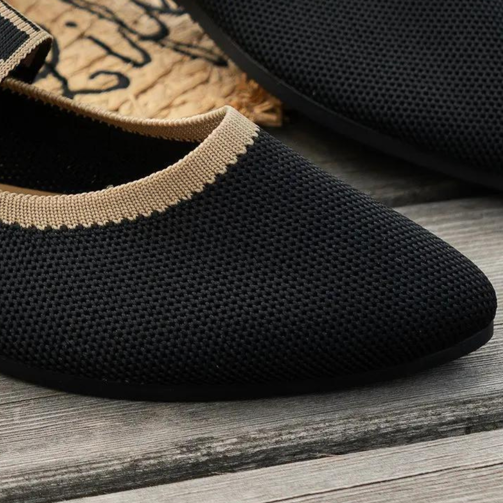 Zwarte gebreide damesschoen met beige rand, comfortabele en ademende stof, perfect voor dagelijks gebruik. Stijlvolle en moderne uitstraling.