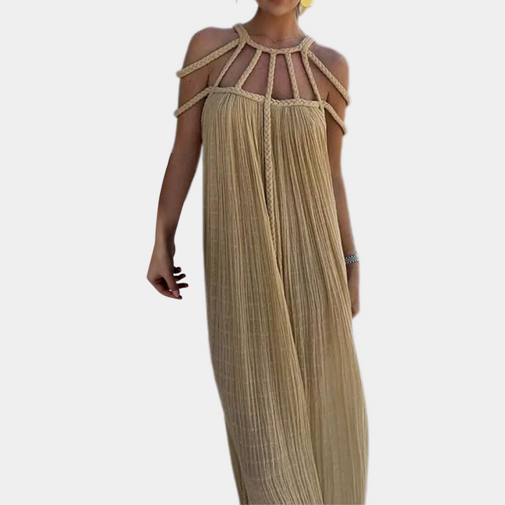 Beige maxi-jurk met gevlochten bandjes, off-shoulder ontwerp, luchtige stof. Perfect voor zomerse gelegenheden en stranduitjes.