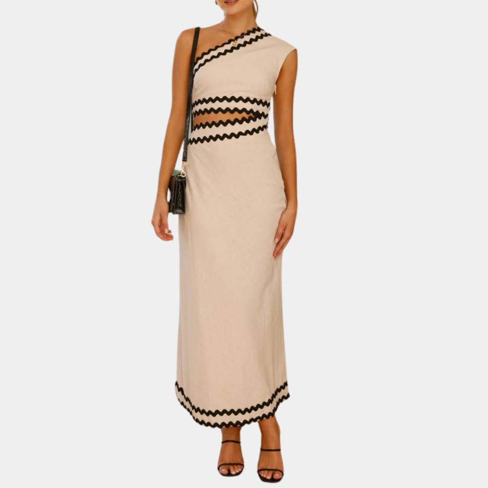 Elegante asymmetrische beige jurk met zwarte zigzagdetails, mouwloos ontwerp, ideaal voor zomerse evenementen. Trendy damesmode, avondjurk.