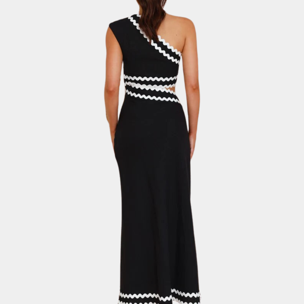 Zwarte asymmetrische jurk met witte zigzagdetails, mouwloos ontwerp, elegante avondjurk, rugaanzicht, modieuze dameskleding.