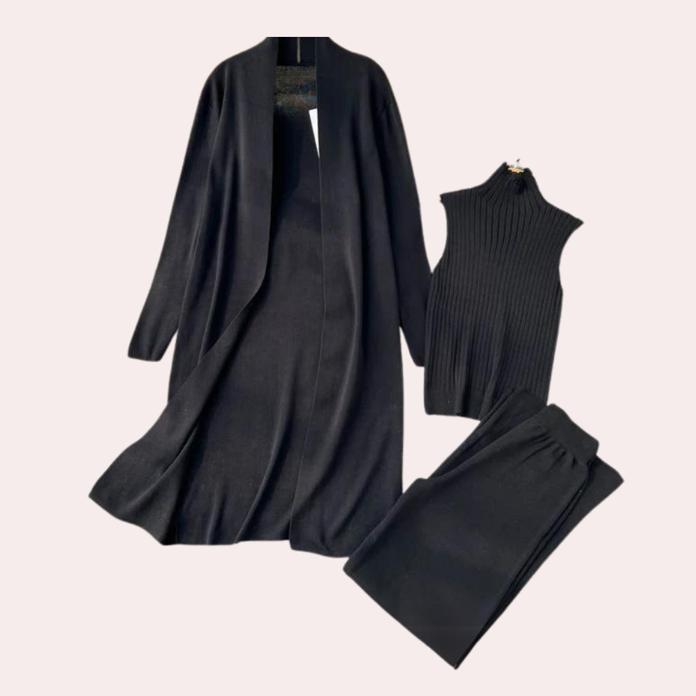 Zwarte dameskleding set met lange jas, mouwloze trui en broek. Stijlvolle, elegante outfit voor herfst en winter. Perfect voor casual en zakelijke looks.