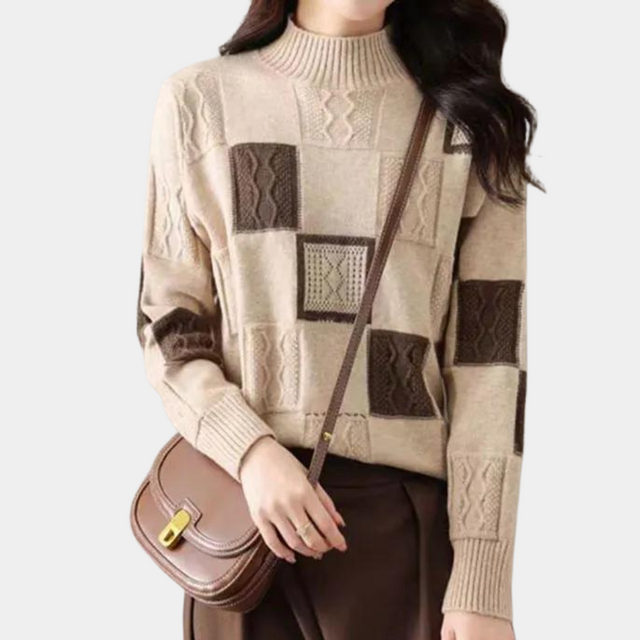 Damestrui met blokpatroon in beige en bruin, gecombineerd met een bruine schoudertas. Modieuze herfstkleding, gebreide textuur.