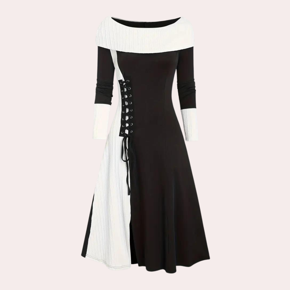 Zwart-witte jurk met boothals en lange mouwen, asymmetrisch ontwerp, veterdetail aan de zijkant. Elegante damesmode, geschikt voor avondkleding.