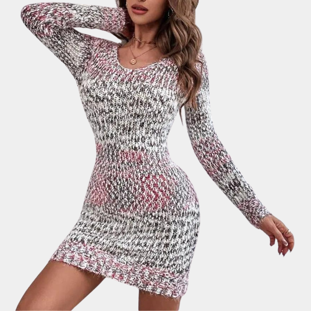 Vrouw in gebreide jurk met lange mouwen, rood-grijs patroon, modieuze herfstkleding, casual stijl, comfortabele pasvorm, trendy damesmode.