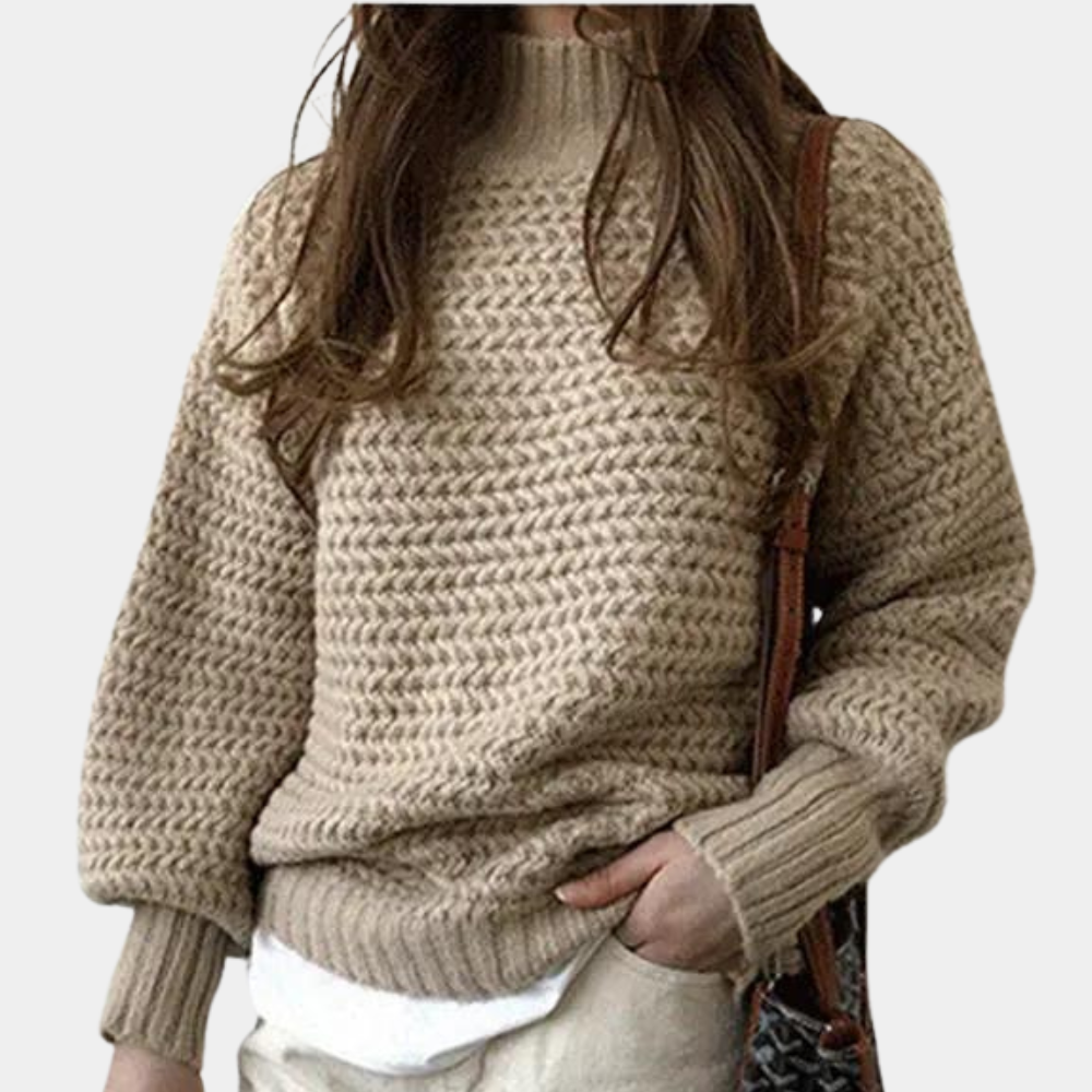 Damestrui in abrikooskleur, gebreid met grove steken, lange mouwen, hoge hals. Perfect voor herfstmode en casual outfits.