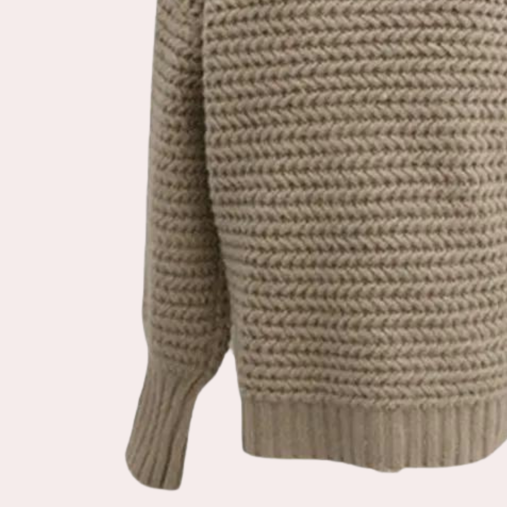 Beige gebreide trui met lange mouwen, geribbelde boorden en textuurpatroon. Perfect voor herfstmode en casual outfits. Comfortabel en stijlvol.
