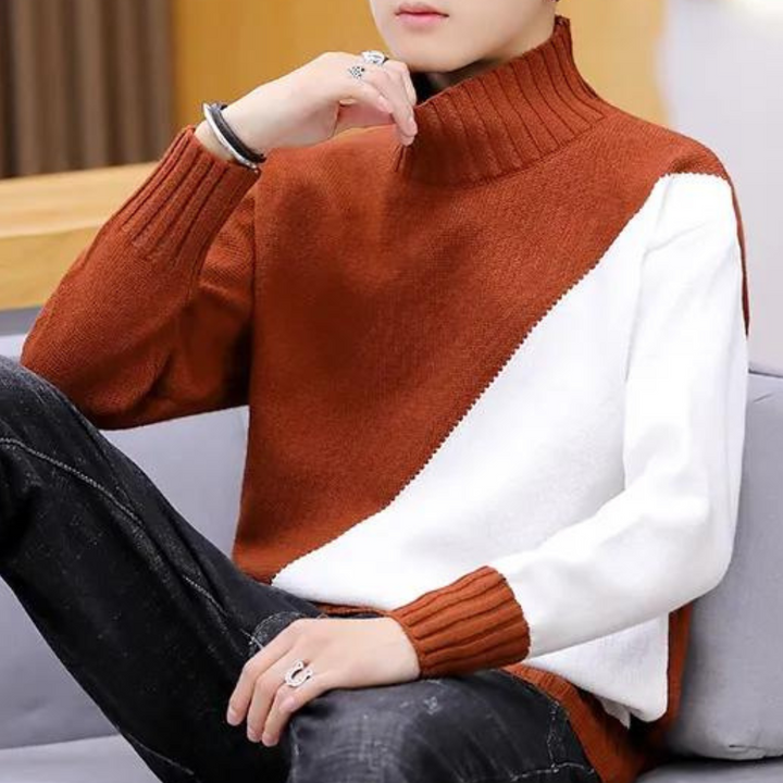 Oranje en witte trui met col, gedragen door een persoon, zittend op een bank. Modieuze herenkleding, herfst-winter stijl, casual outfit.