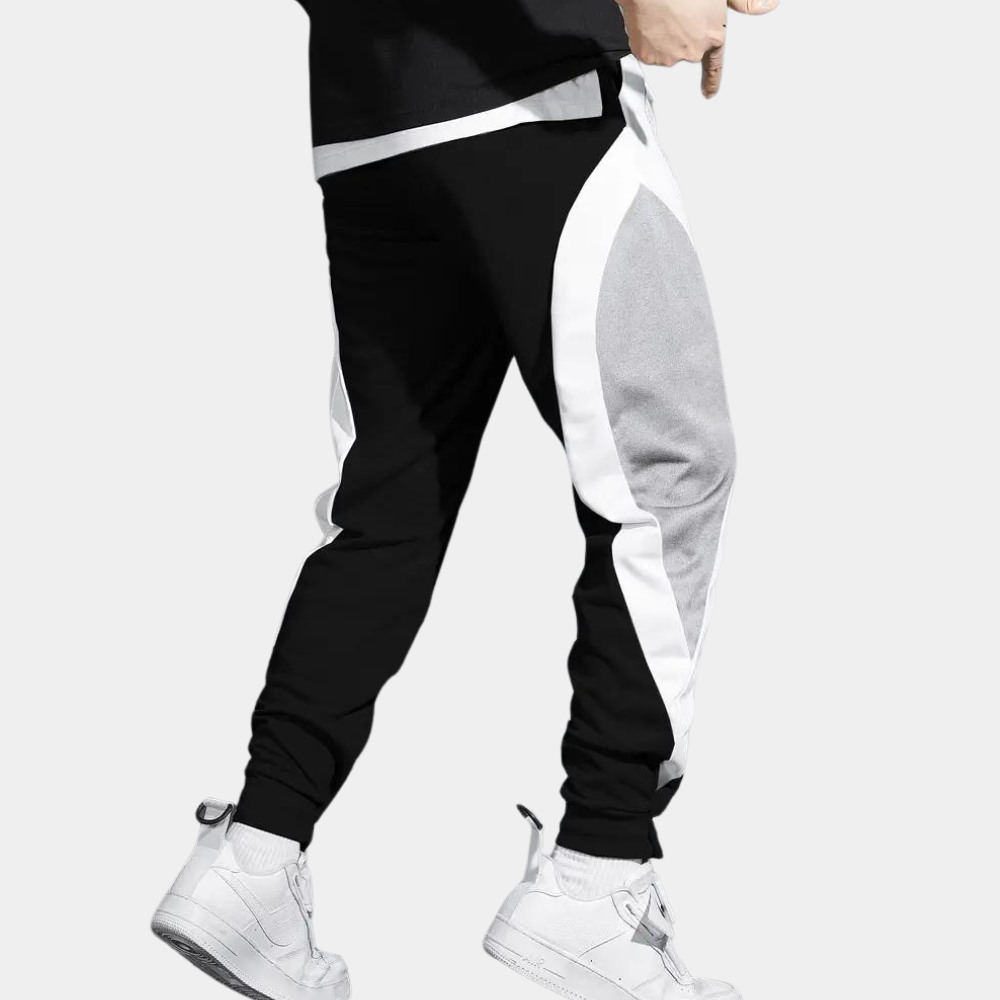 Zwart-witte joggingbroek met grijze accenten, sportief design, comfortabele pasvorm, ideaal voor casual en sportieve outfits, unisex stijl.