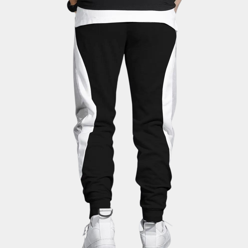 Zwart-witte joggingbroek voor heren, sportief design, comfortabele pasvorm, ideaal voor casual en sportieve activiteiten.