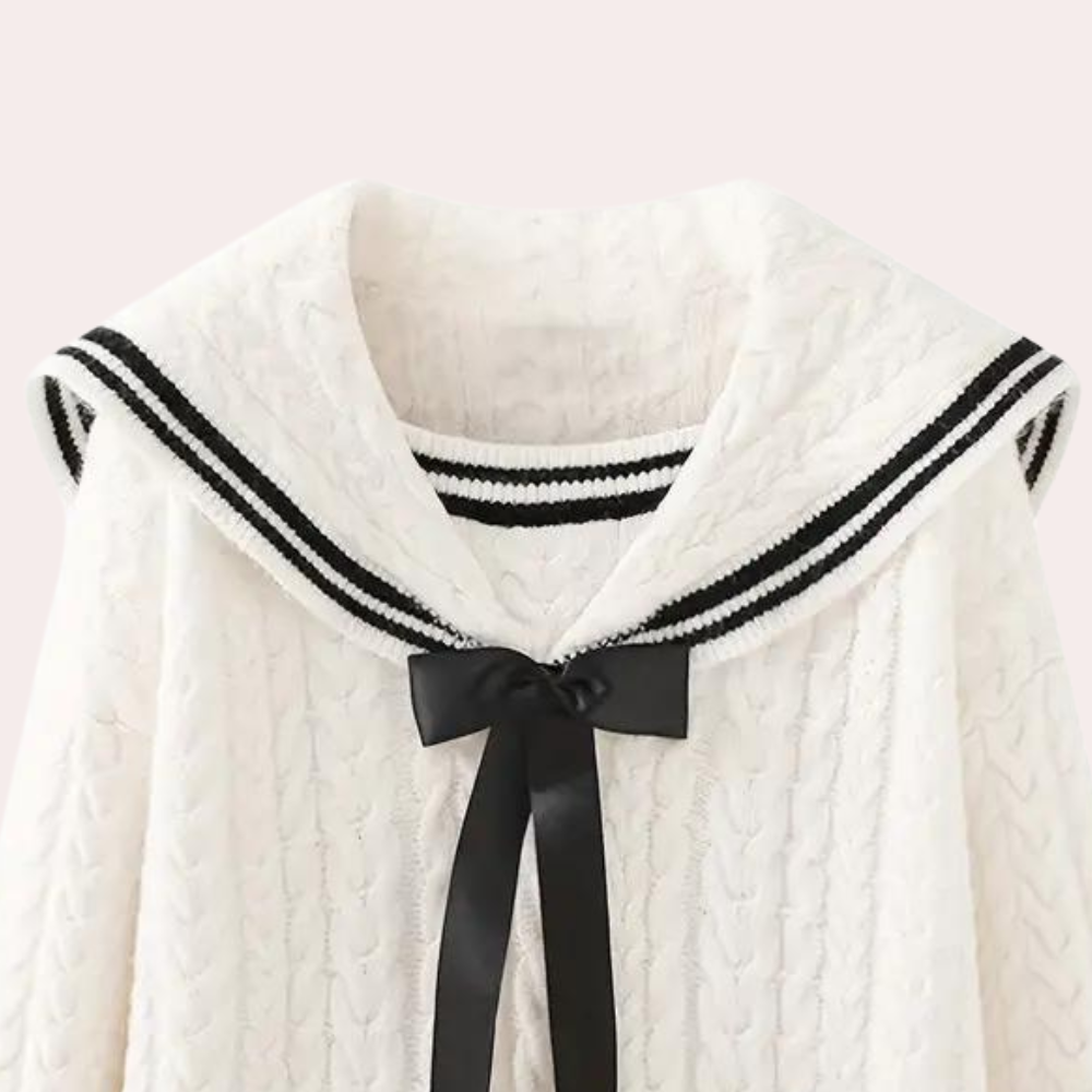 Witte kabeltrui met zwarte strik en gestreepte kraag, damesmode, stijlvolle herfst- en winterkleding, trendy gebreide kleding.
