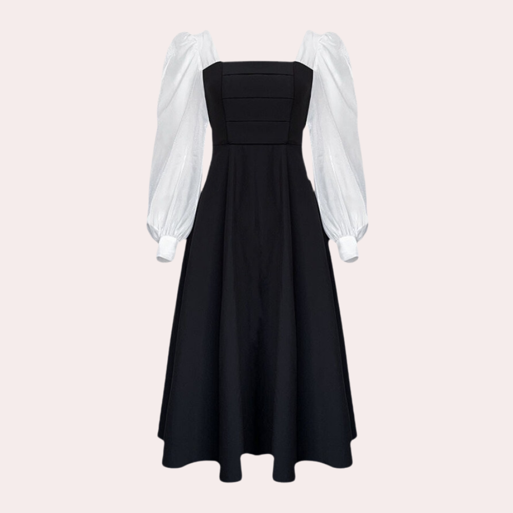 Zwart-witte jurk met lange pofmouwen en vierkante halslijn, elegante avondjurk, modieuze dameskleding, tijdloze stijl.