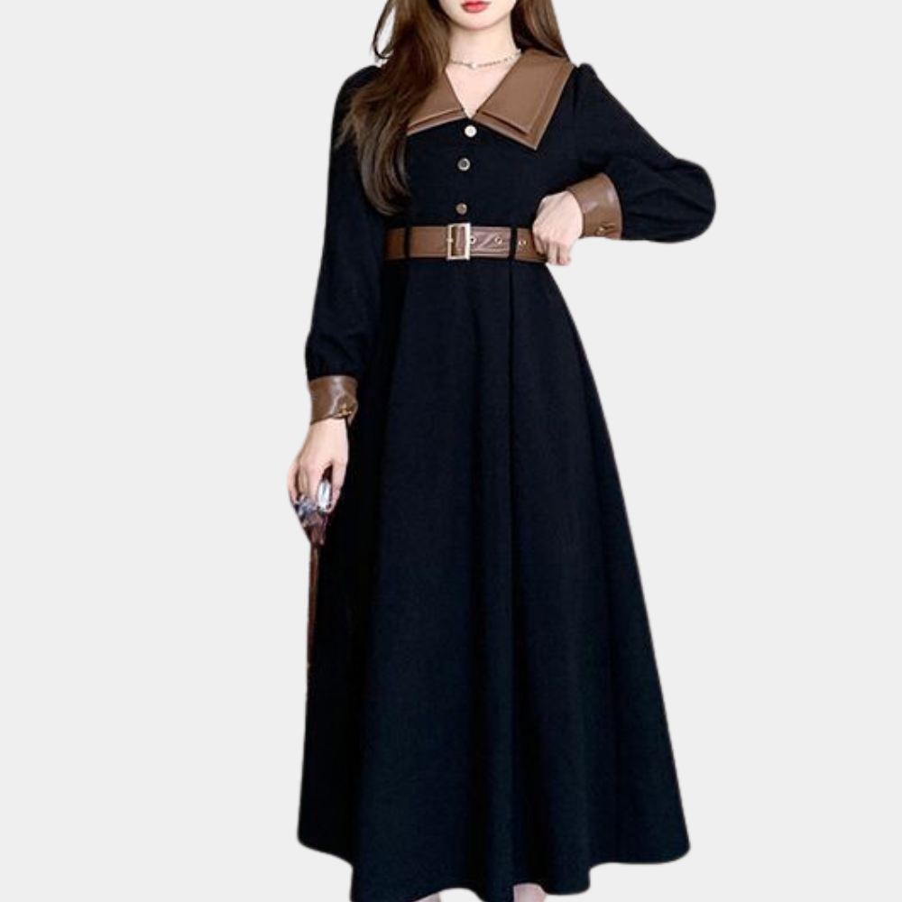 Elegante zwarte damesjurk met bruine kraag en manchetten, lange mouwen, knopen en riem. Perfect voor formele gelegenheden en modieuze outfits.