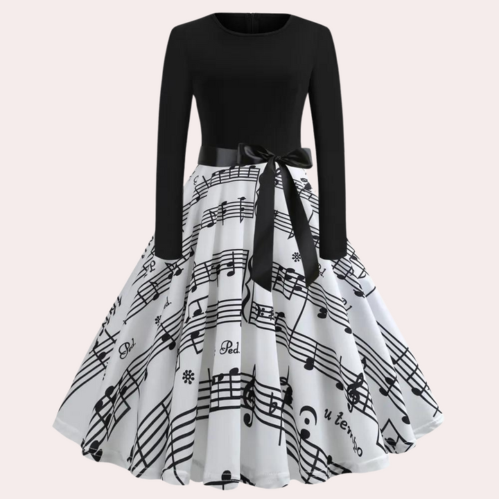 Zwart-witte vintage jurk met muzieknotenprint, lange mouwen en strikdetail. Perfect voor retro mode en muziek liefhebbers. Elegante dameskleding.