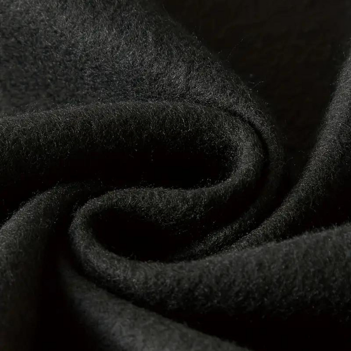 Zwarte wollen stof close-up, zachte textuur, hoogwaardige textielmaterialen, geschikt voor kleding en interieur, luxe en duurzaam.