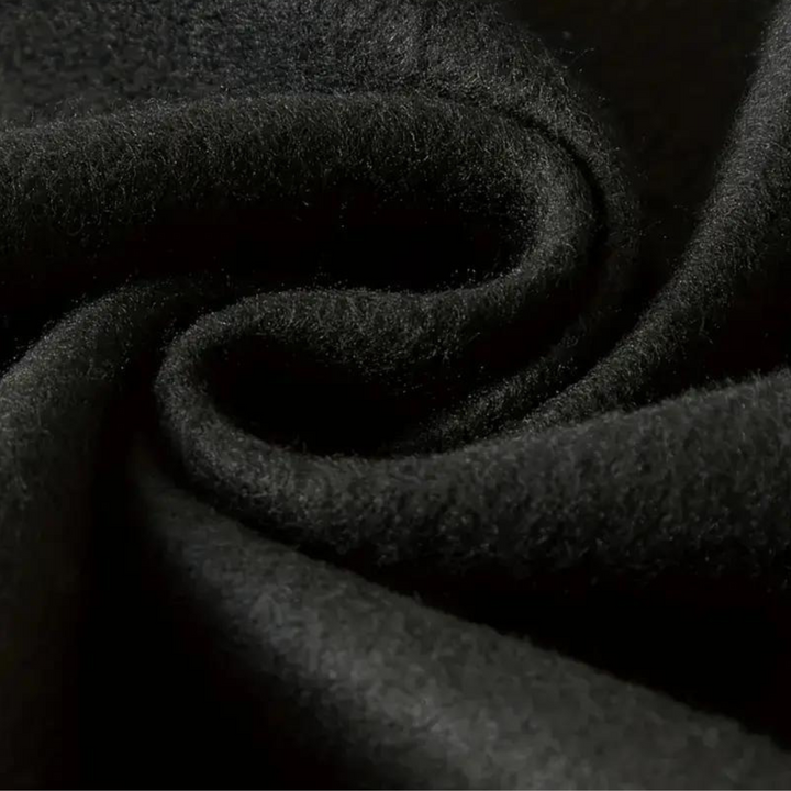 Zwarte wollen stof close-up, zachte textuur, hoogwaardige textielmaterialen, geschikt voor kleding en interieur, luxe en duurzaam.