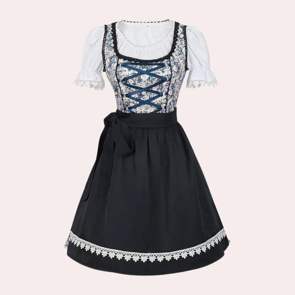 Zwarte dirndl jurk met bloemenpatroon, witte blouse en kanten details. Traditionele Beierse kleding, perfect voor Oktoberfest.