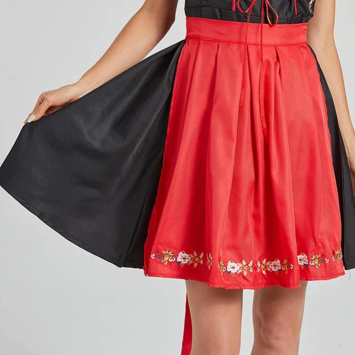 Rode rok met zwarte onderrok en geborduurde bloemen, damesmode, elegante kleding, traditionele stijl, hoogwaardige stof, modetrend.