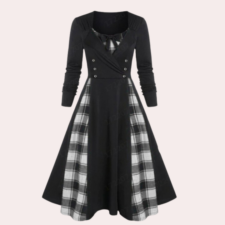 Zwart-wit geruite vintage jurk met lange mouwen en knoopdetails, elegante retro stijl, perfect voor herfstmode en casual chique outfits.