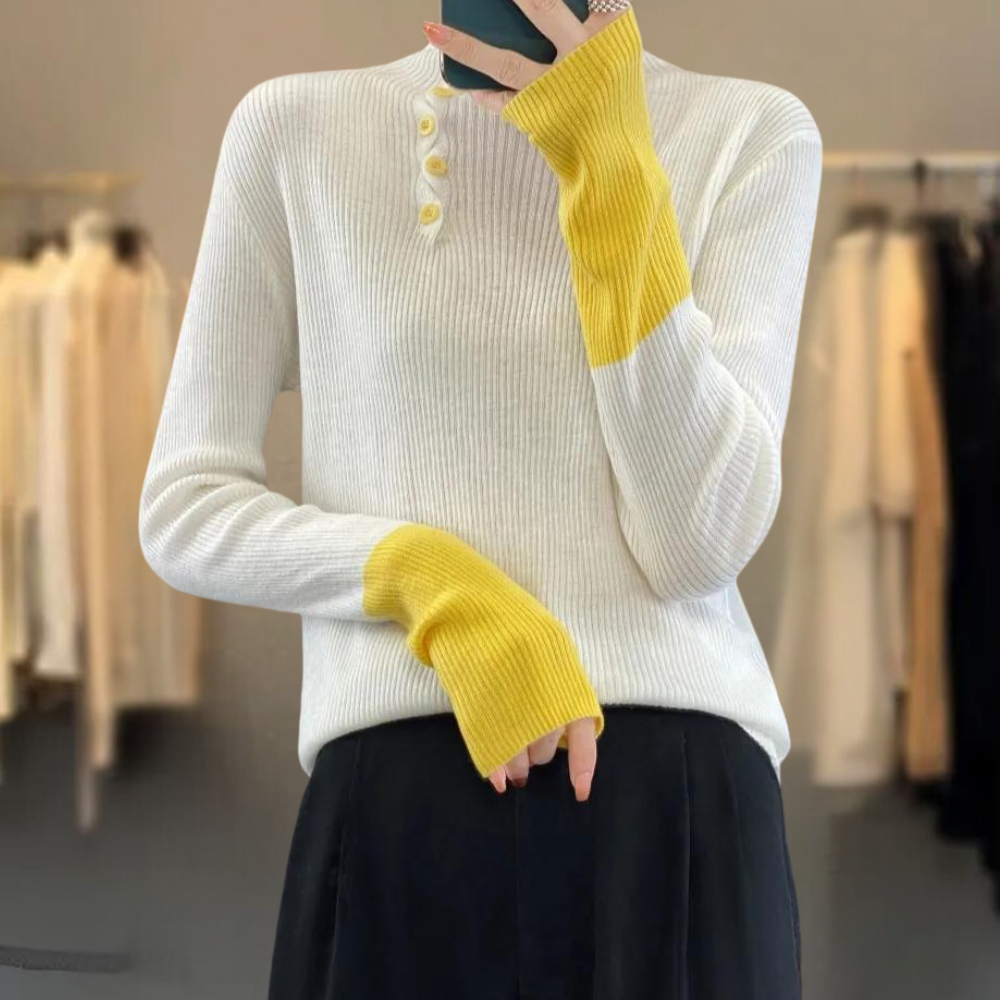 Witte trui met gele mouwen, ribgebreid, driekwart knopen, damesmode, herfst-winter, casual stijl, comfortabele pasvorm, trendy kleding.