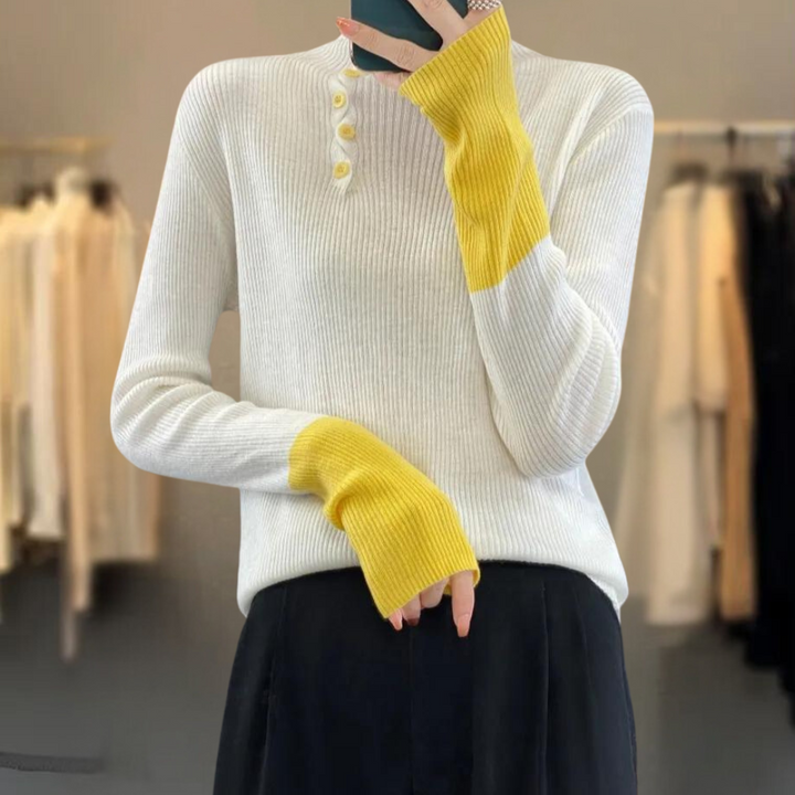 Witte trui met gele mouwen, ribgebreid, driekwart knopen, damesmode, herfst-winter, casual stijl, comfortabele pasvorm, trendy kleding.