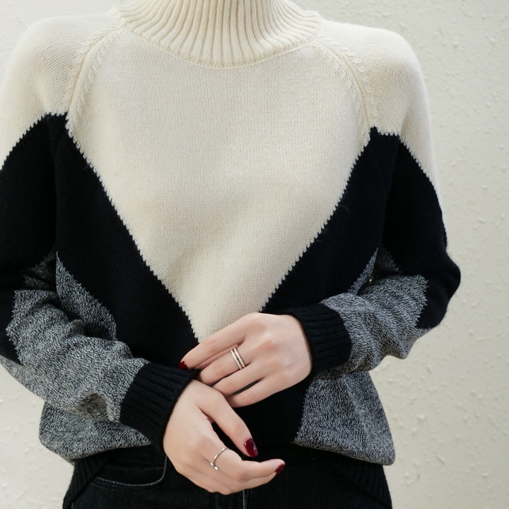 Damestrui met col, zwart-wit geometrisch patroon, gebreid, lange mouwen, casual wintermode, stijlvolle dameskleding.