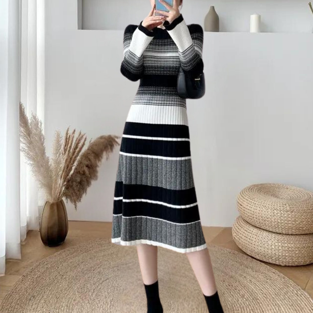 Zwart-wit gestreepte gebreide jurk, lange mouwen, elegante stijl, herfstmode, vrouwelijk, comfortabele pasvorm, geschikt voor dagelijks gebruik.