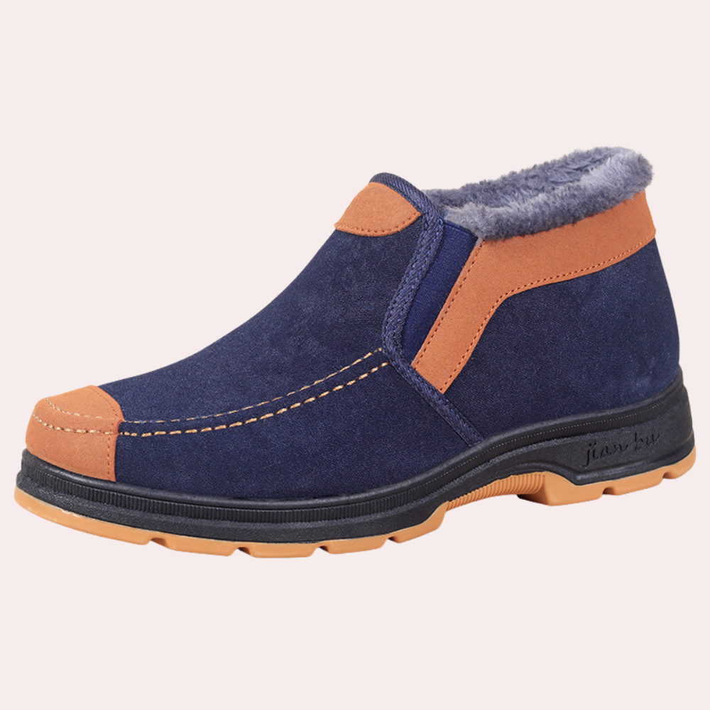 Donkerblauwe suède herenschoen met bruine accenten, warme voering en stevige rubberen zool. Comfortabele winterlaars voor dagelijks gebruik.