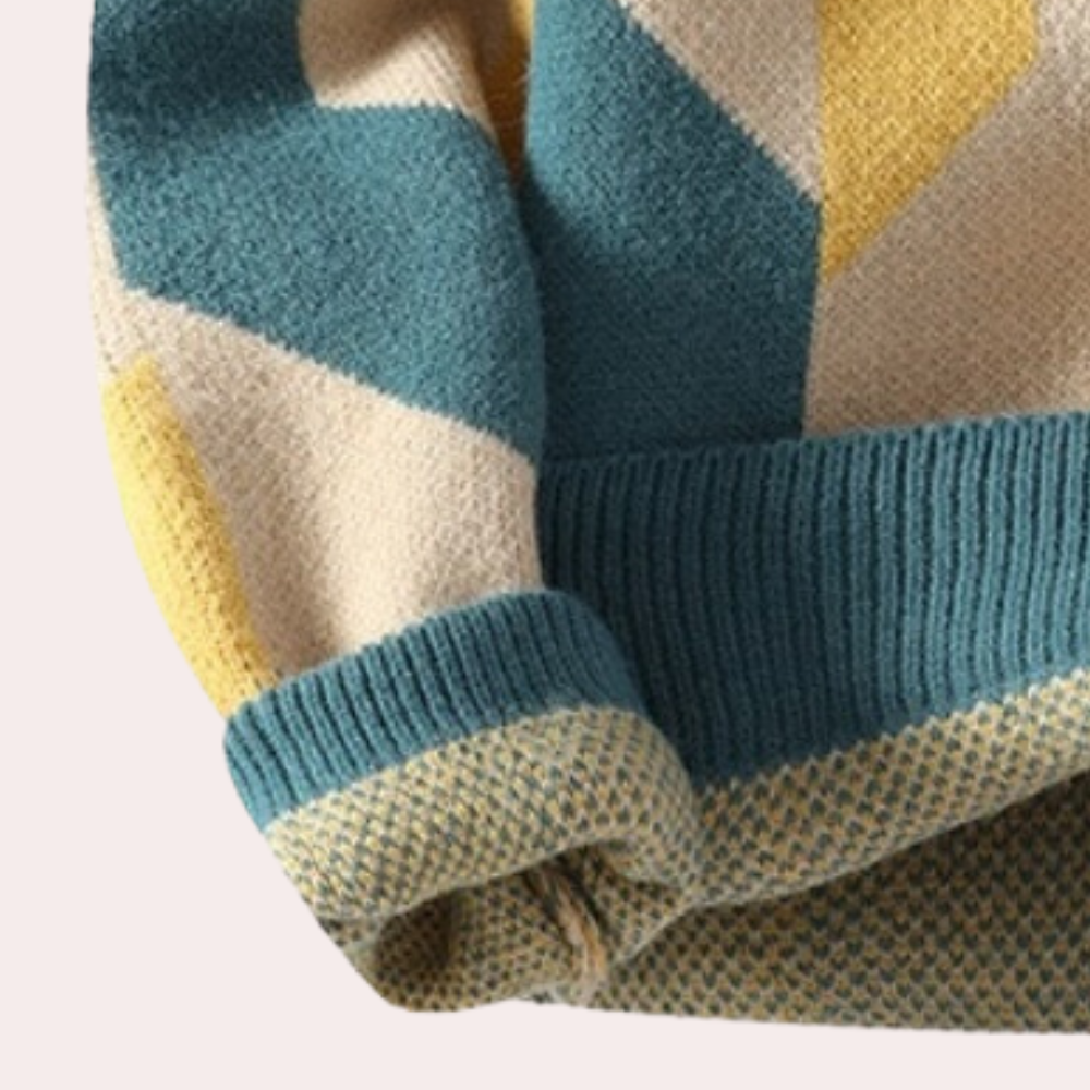 Blauwe en gele geometrische trui met gebreide manchetten en zoom, moderne wintermode, warme kleding, stijlvolle damestrui.