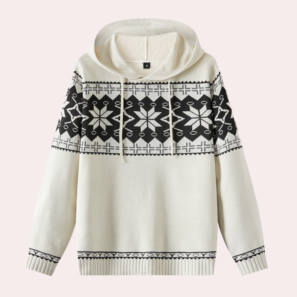 Witte gebreide hoodie met zwart Noors patroon, sneeuwvlokken en geometrische motieven. Wintermode, warme trui, unisex kleding.