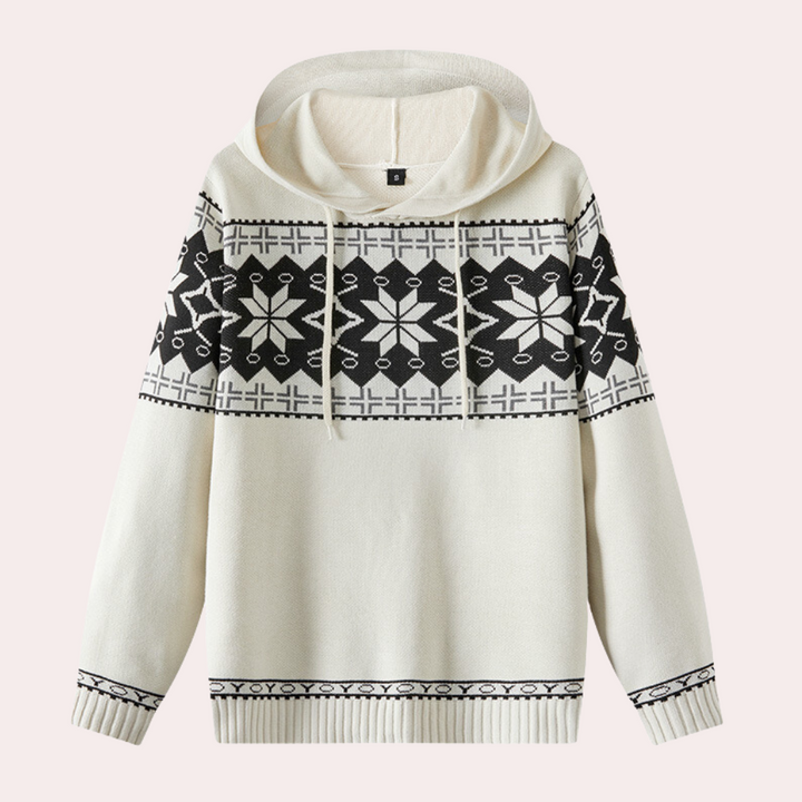 Witte gebreide hoodie met zwart Noors patroon, sneeuwvlokken en geometrische motieven. Wintermode, warme trui, unisex kleding.