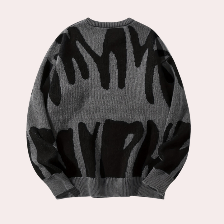 Grijze trui met abstract zwart patroon, lange mouwen en ronde hals. Modieuze herentrui, comfortabele pasvorm, ideaal voor casual winterkleding.