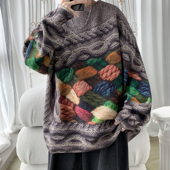 Bruine oversized trui met kleurrijk gebreid patroon, geschikt voor herfst- en wintermode. Comfortabele, warme dameskleding, trendy en stijlvol design.