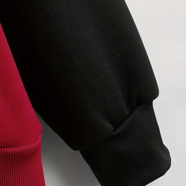 Zwart-rode trui detail met geribbelde manchetten, hoogwaardige stof. Modieuze kleding, comfortabele pasvorm, unisex design.