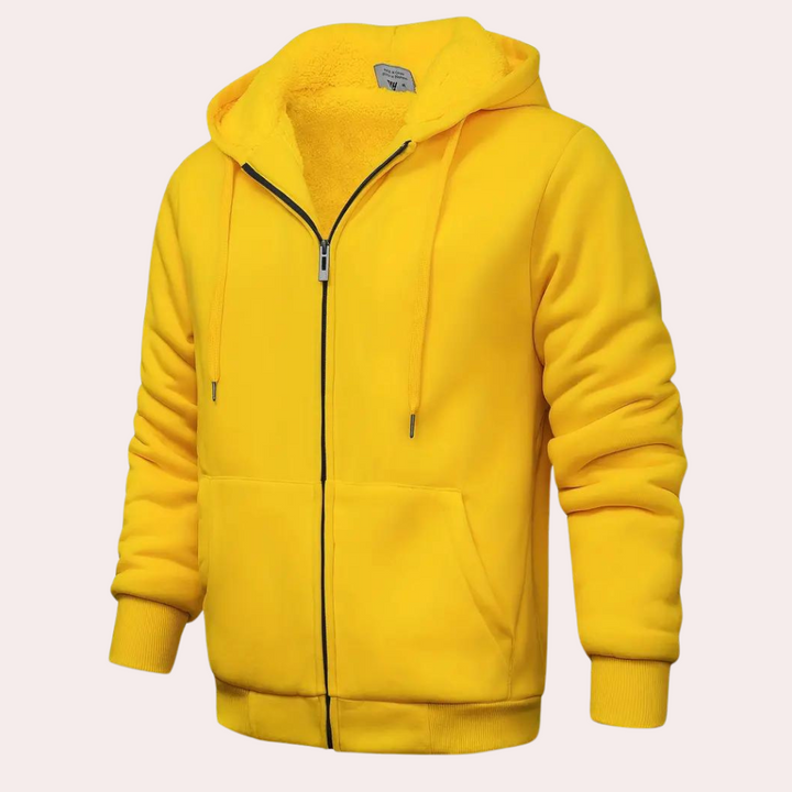 Gele hoodie met capuchon, ritssluiting en zakken, gemaakt van zachte stof. Perfect voor casual en sportieve outfits. Unisex kledingstuk.