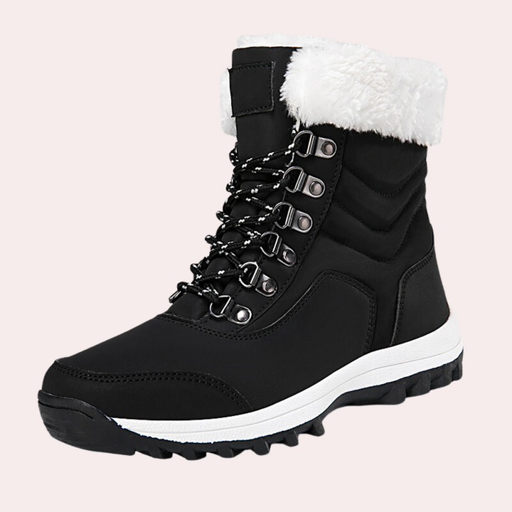 Zwarte winterlaars met witte bontkraag, stevige rubberen zool en metalen veterogen. Ideaal voor koude weersomstandigheden en outdoor activiteiten.